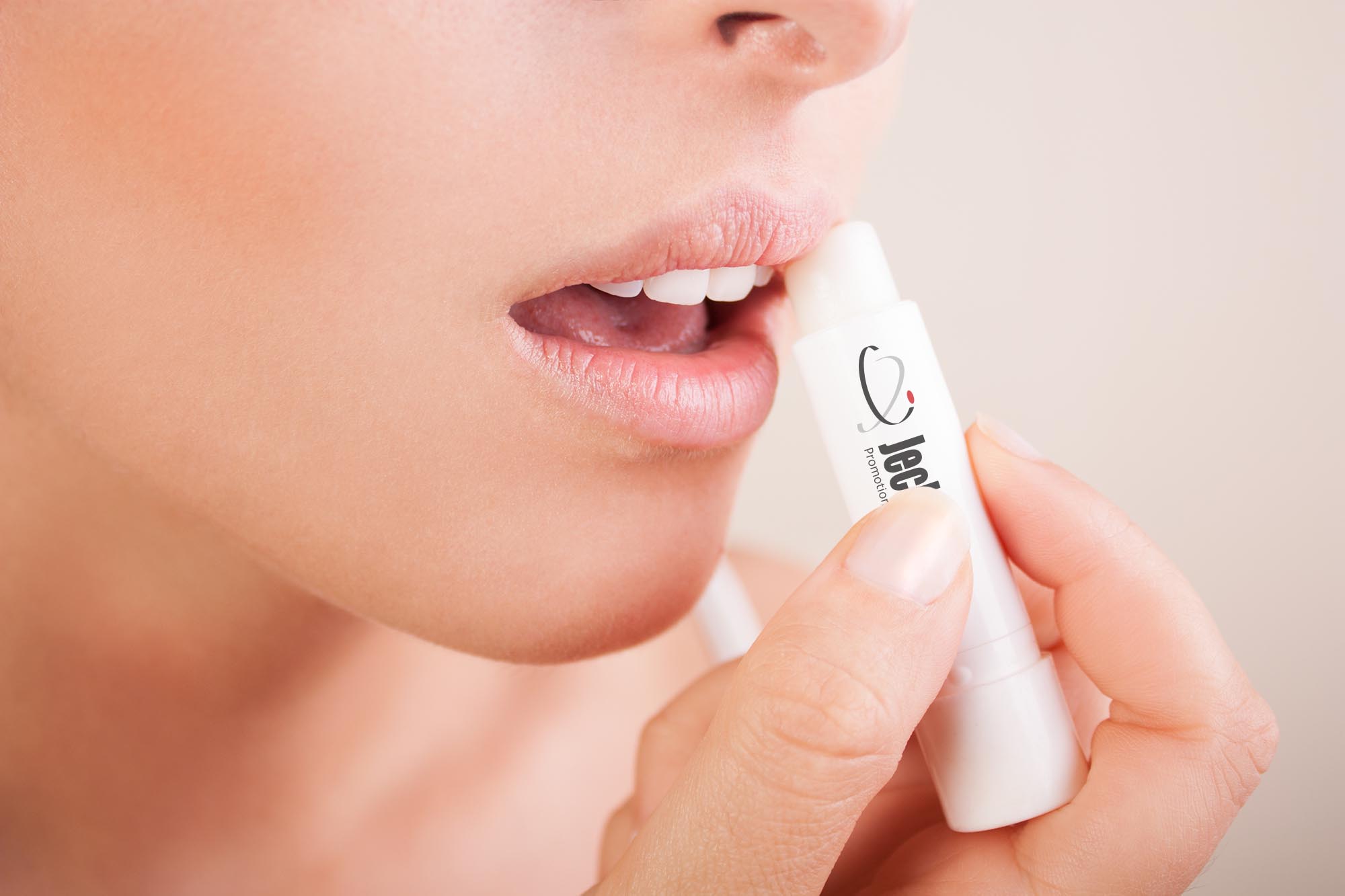 Lips care.woman applying balsam on lips